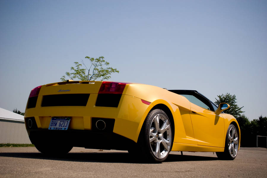 4k Lamborghini In Vibrant Yellow Color Wallpaper