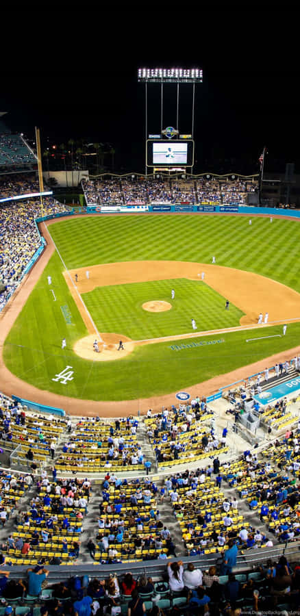 A Baseball Field With A Lot Of People Watching Wallpaper