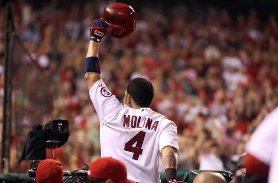 A Baseball Player Is Raising His Bat Wallpaper