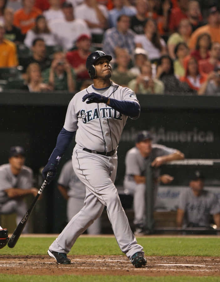 A Baseball Player Swinging A Bat Wallpaper