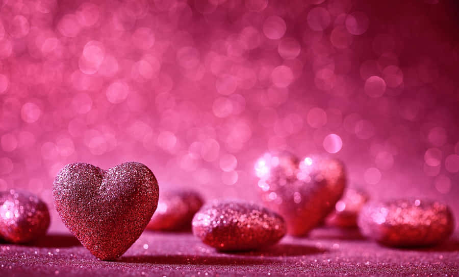 A Beautiful Display Of Glittery Pink Hearts Wallpaper