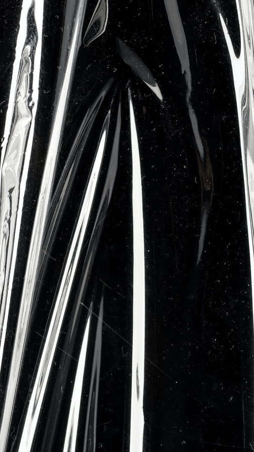 A Black And Silver Plastic Bag With A Silver Lining Wallpaper