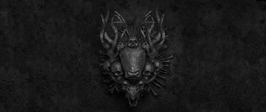 A Black And White Image Of A Skull On A Wall Wallpaper