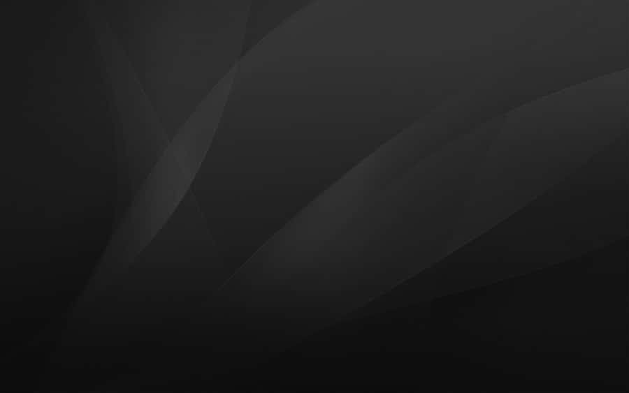 A Black Background With A Black Wavy Pattern Wallpaper