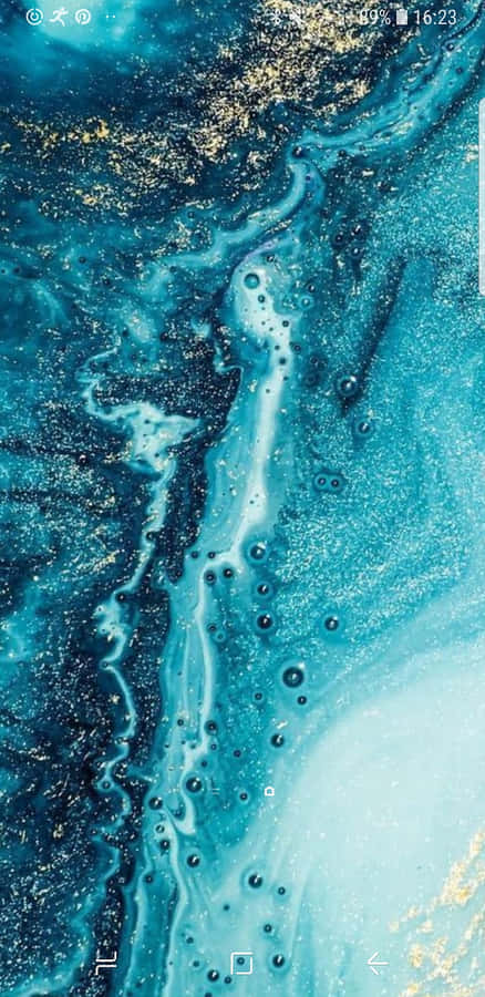 A Blue And Gold Wallpaper With A Blue And Gold Background Wallpaper