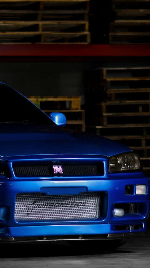 A Blue Car Parked In A Garage Wallpaper