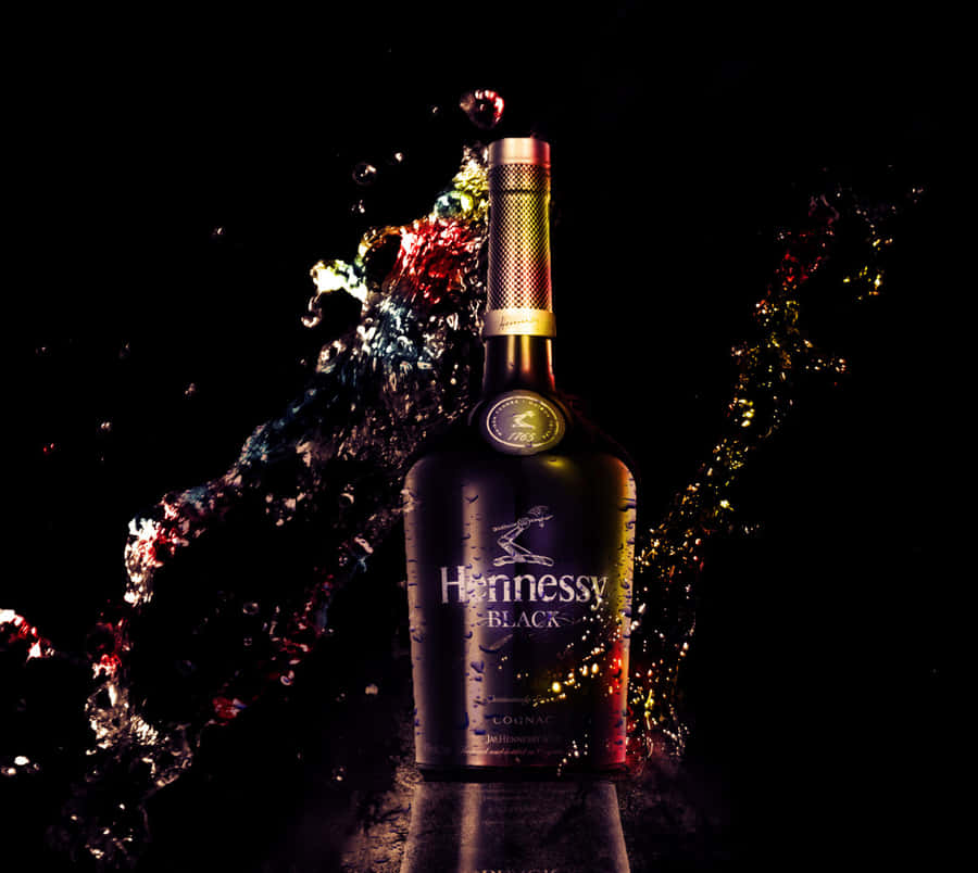 A Bottle Of Helensson Scotch With Splashes Of Water Wallpaper