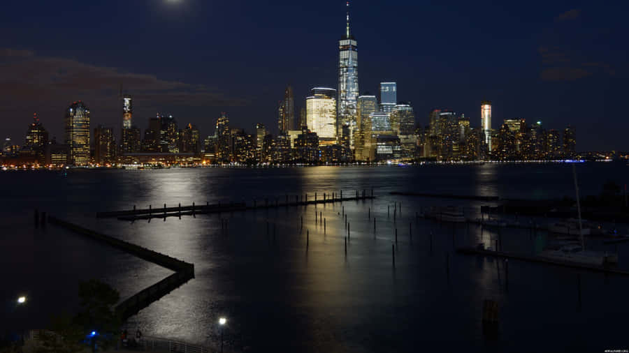A Breathtaking Sunrise Over The Iconic New York City Skyline. Wallpaper