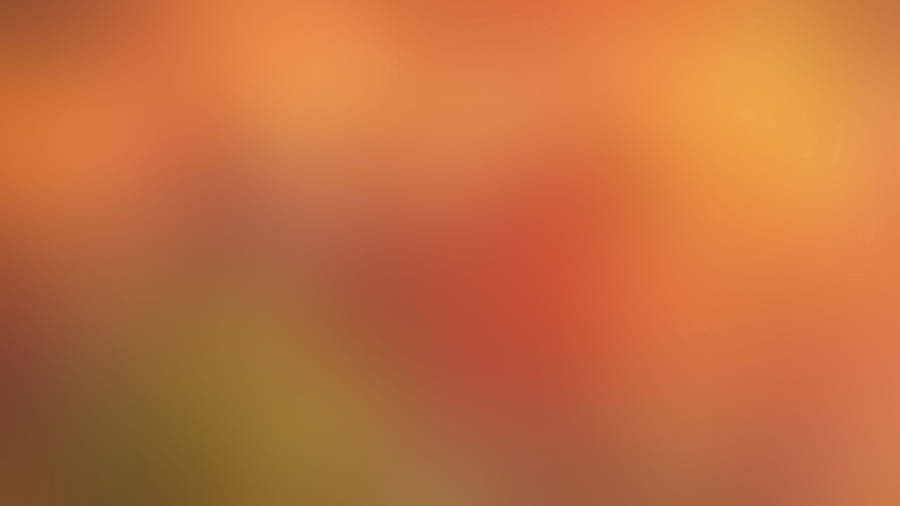 A Bright Red Spot In A Blurred Background. Wallpaper