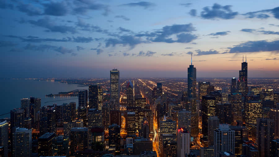 A Bustling City Skyline During Sunset Wallpaper
