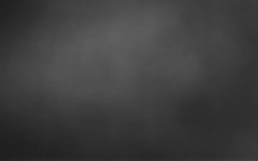 A Calm And Cool Gray Mountain Reflection Wallpaper