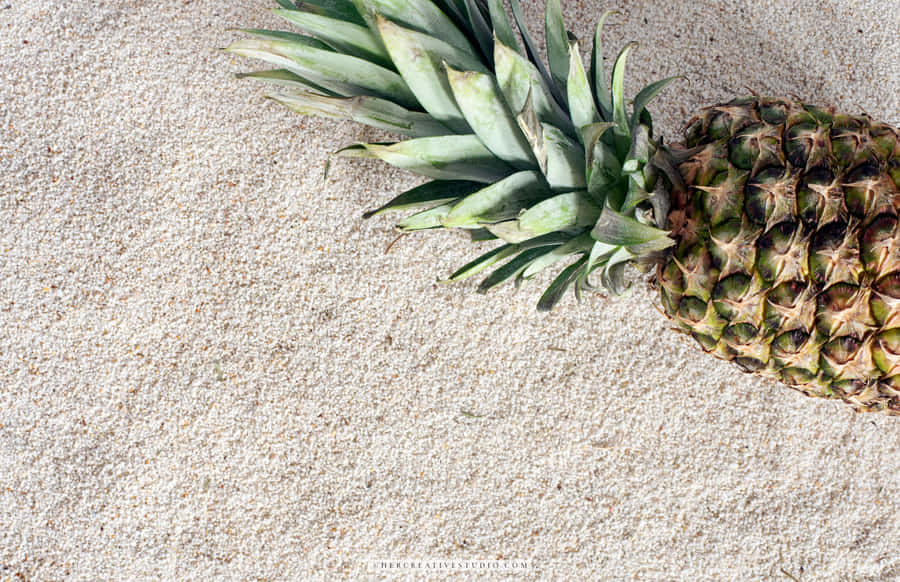 A Desktop Background Featuring A Ripe Pineapple On A Neutral Background Wallpaper