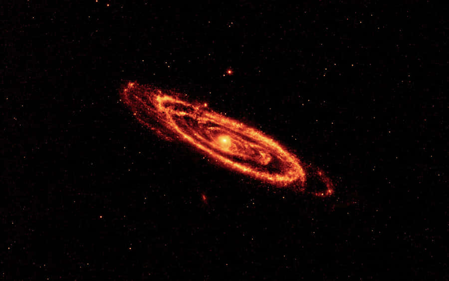 A Grand Celestial View Of The Andromeda Galaxy Wallpaper