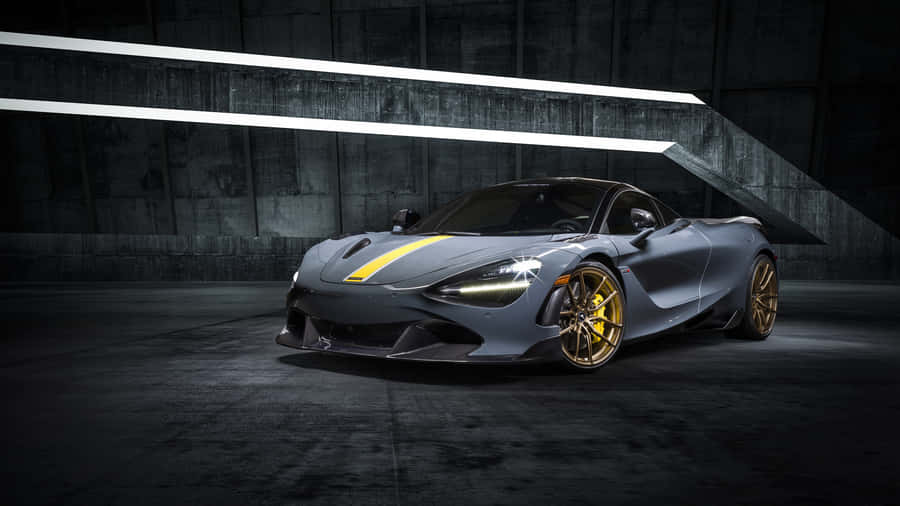 A Grey Sports Car Is Parked In A Dark Room Wallpaper