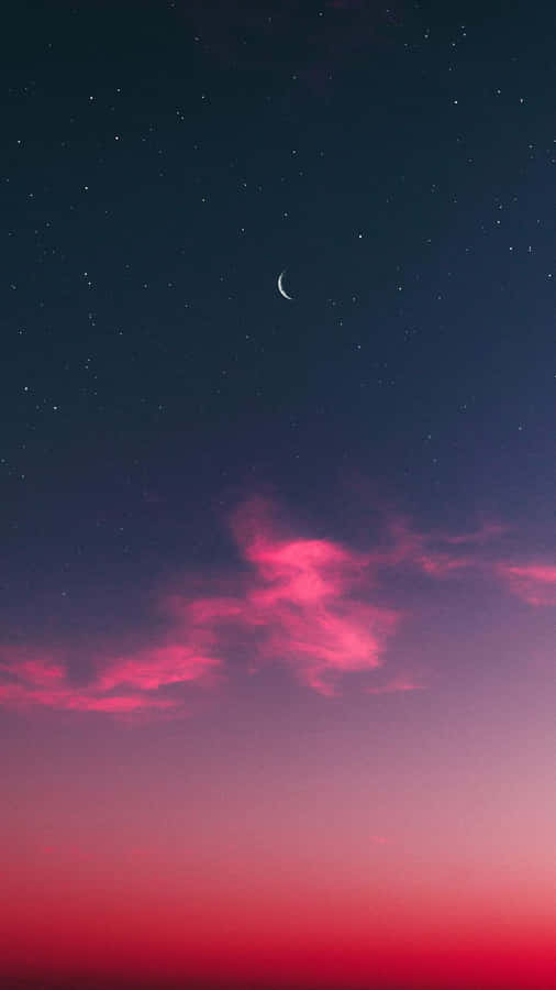 A Lovely Sunset View Of Dreamy Clouds Against A Hilly Landscape Wallpaper