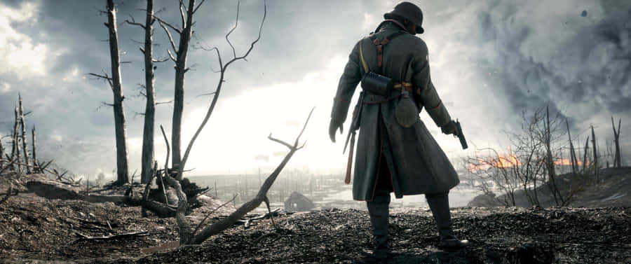 A Man In A Trench Coat Is Standing In Front Of A Fire Wallpaper