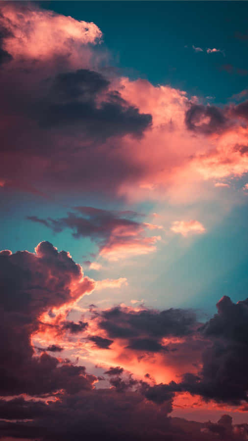 A Peaceful Scene Of Nature Captured Against A Stormy Sky. Wallpaper