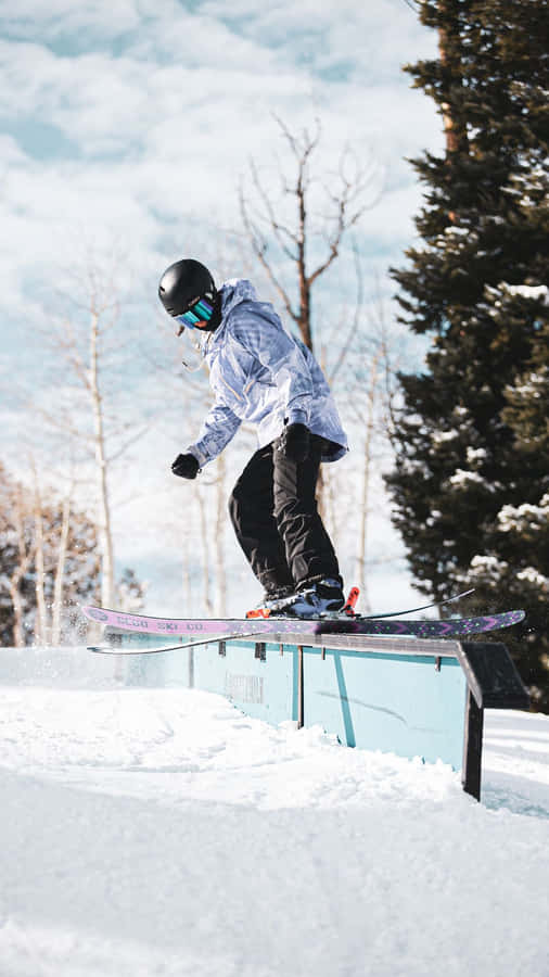A Person Is Snowboarding Wallpaper