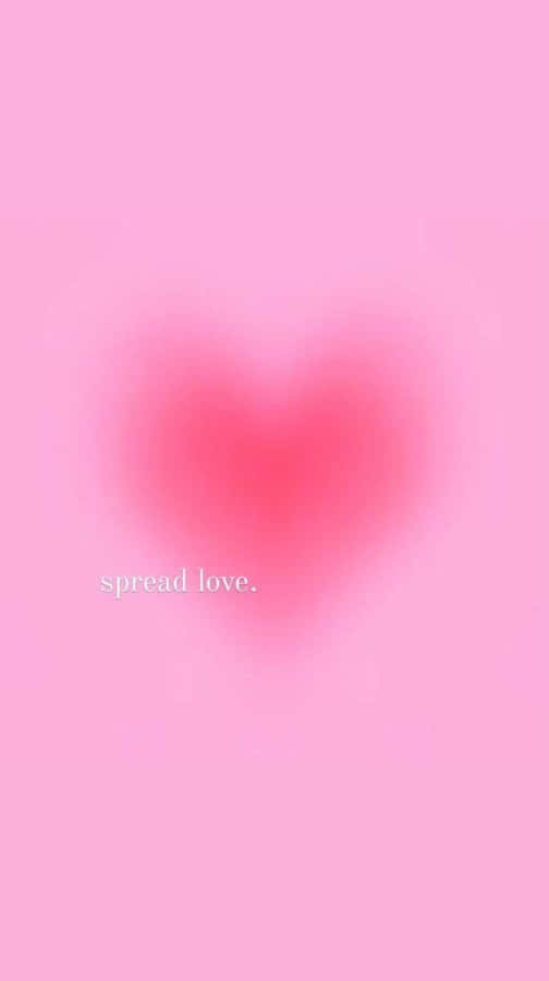 A Pink Heart With The Words Spread Love Wallpaper