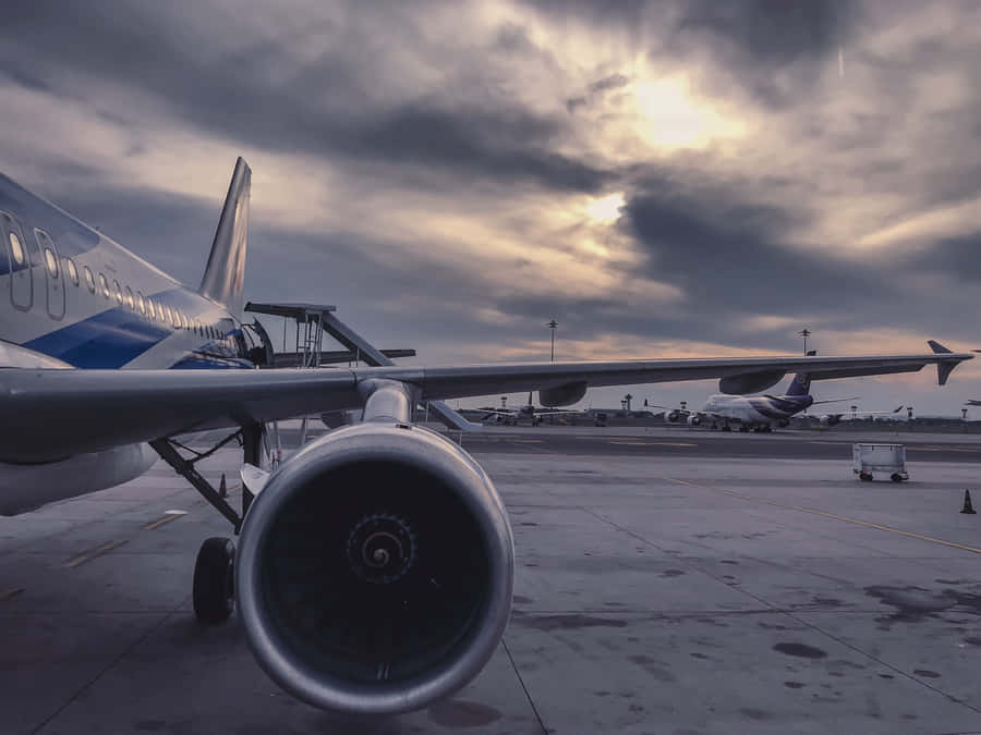 A Plane Flying High In The Sky Wallpaper