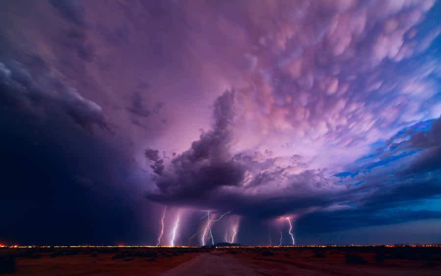 A Powerful Strike Of Purple Lightning Wallpaper