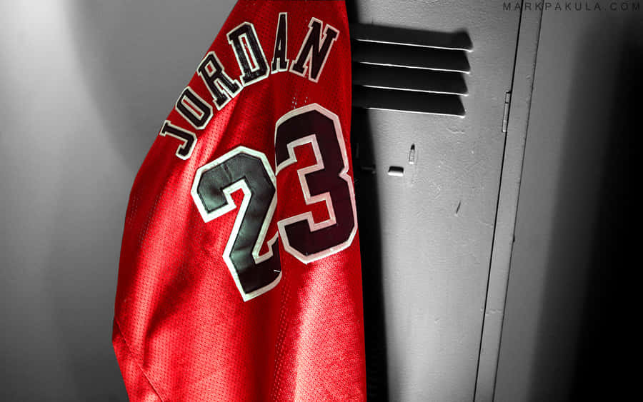 A Red Jersey Hanging On A Wall Wallpaper