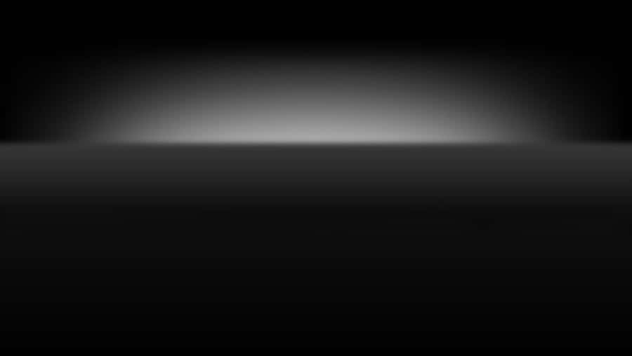 A Sleek And Sophisticated Black Surface Design. Wallpaper