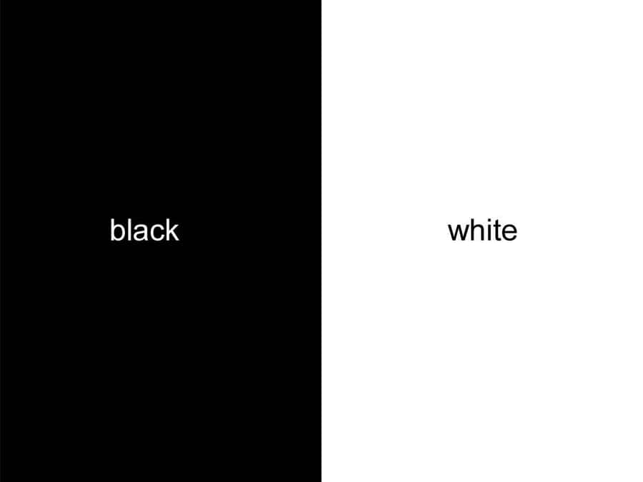 A Striking Contrast Between Half Black And Half White Backgrounds Wallpaper