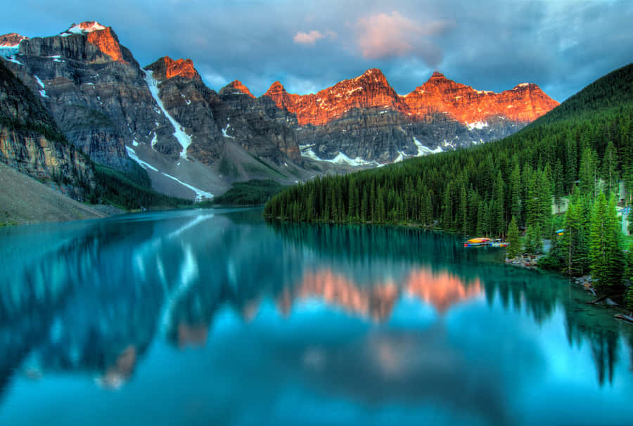 A Stunning View Of Snowcapped Mountains Wallpaper