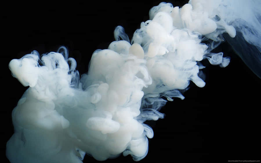 A White Smoke Is Floating In The Air Wallpaper