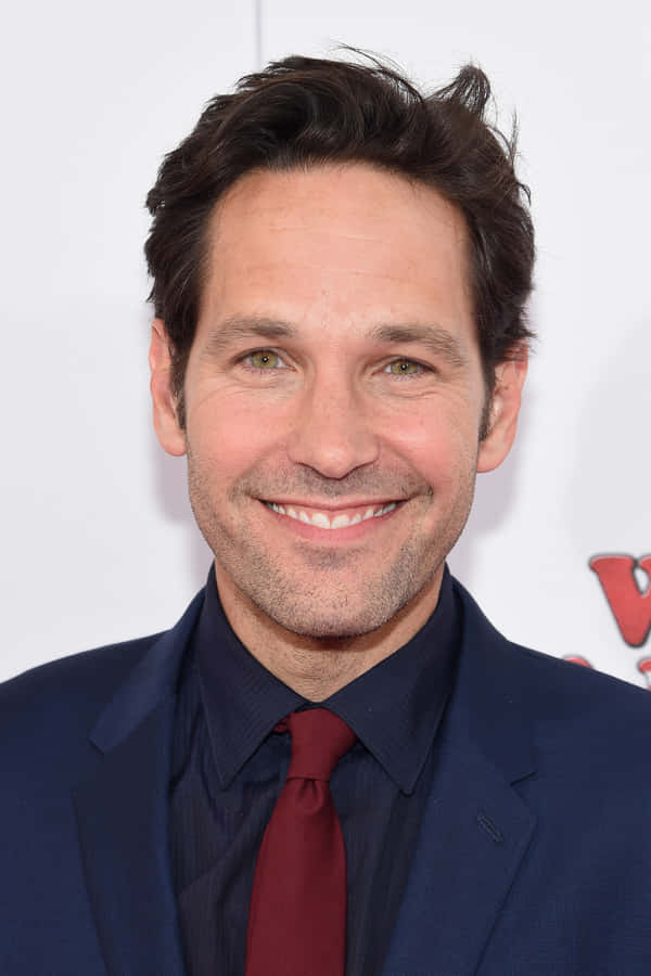 Download free Actor Paul Rudd Strikes A Charming Smile Wallpaper ...