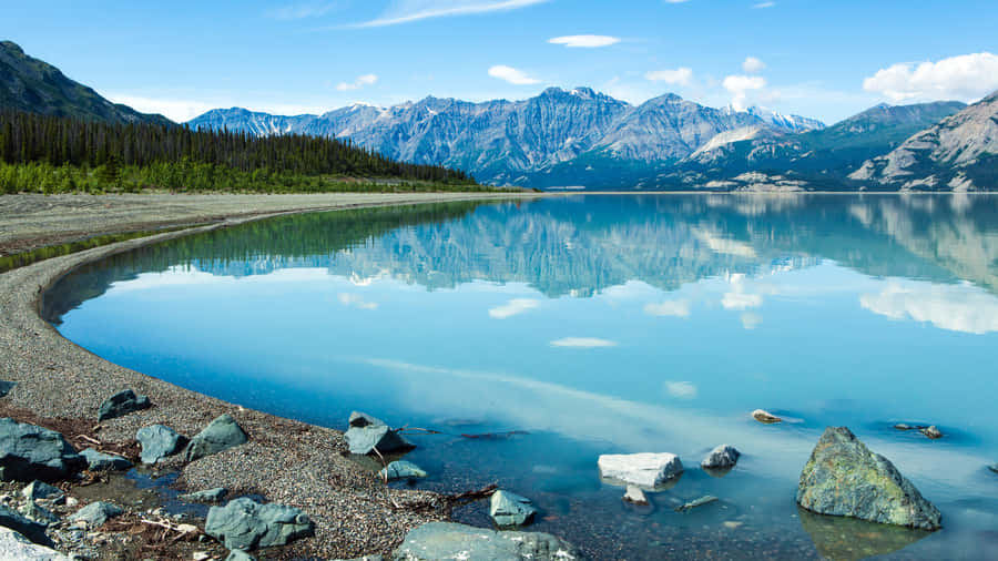 An Exhilarating View Of A Mountainous Landscape Wallpaper