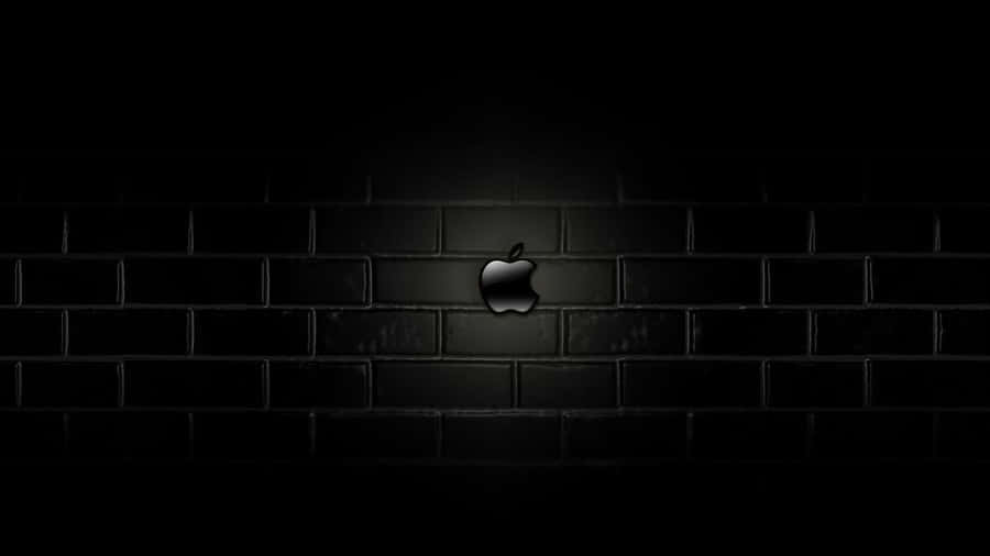 Apple Logo On A Brick Wall In The Dark Wallpaper