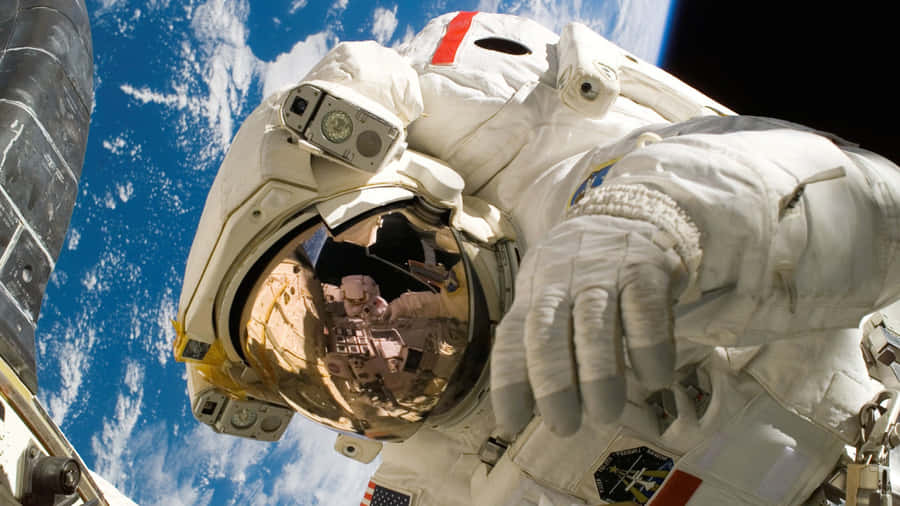 Astronaut Over Earth Desktop Wallpaper