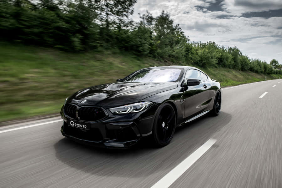 Black Bmw M8 On The Road 4k Wallpaper