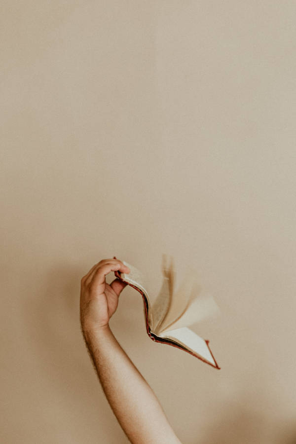 Book And Beige Wall Wallpaper