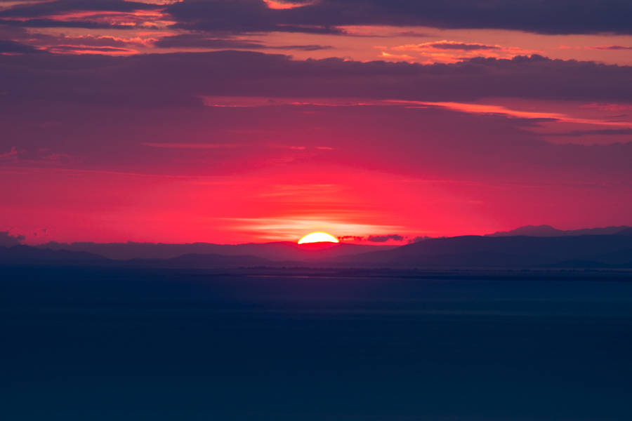 Breathtaking Golden Hour Views Of A Red Sunset Wallpaper