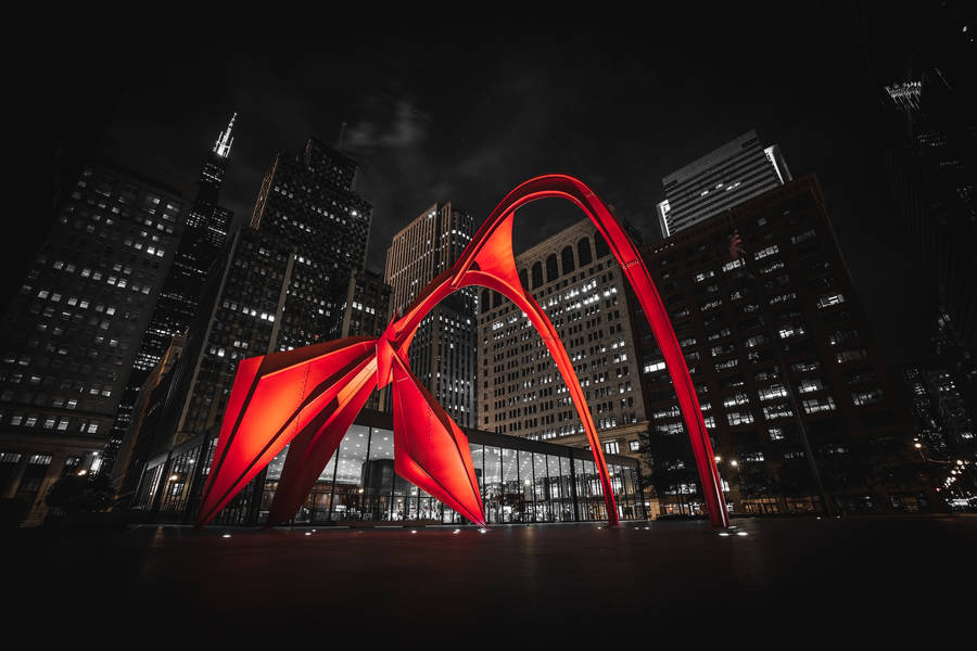 Calder's Flamingo Sculpture Against The Majestic Chicago Skyline Wallpaper