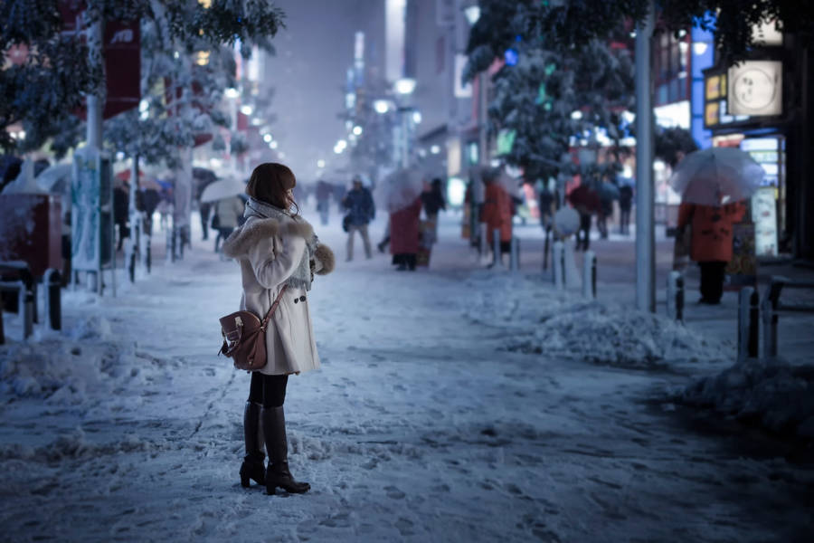 Caption: Enchanting Winter With Graceful Tokyo Girl Wallpaper