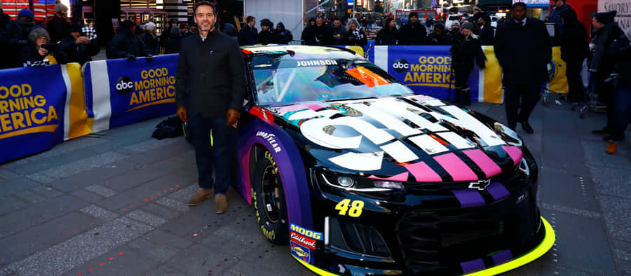 Caption: High Octane Action: Jimmie Johnson In Full Throttle Wallpaper