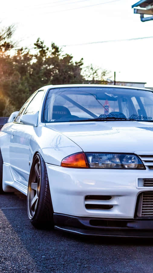 Caption: Striking Power – The Classic Nissan Skyline Wallpaper