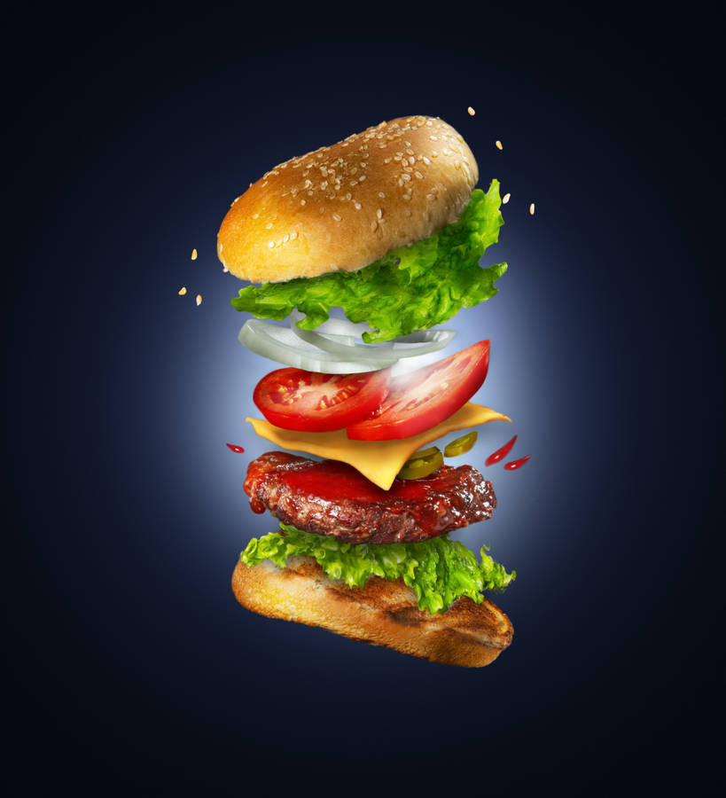 Captivating Floating Cheeseburger Photography Wallpaper