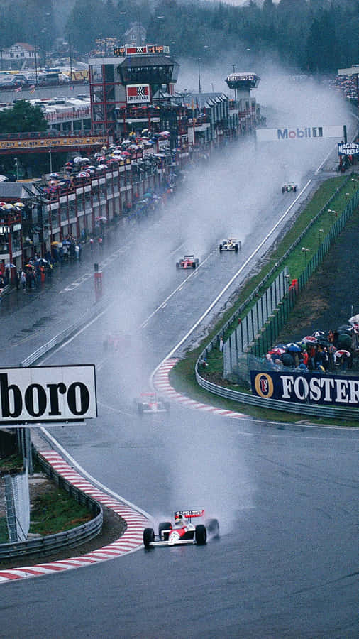 Celebrating The Thrill Of The Race With The Formula 1 Iphone Wallpaper