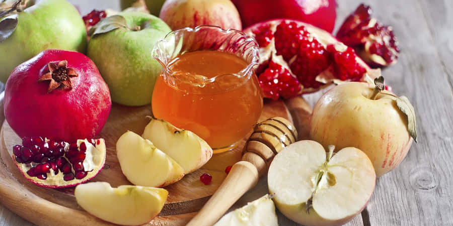 Celebratory Rosh Hashanah Dinner Table Set-up Wallpaper