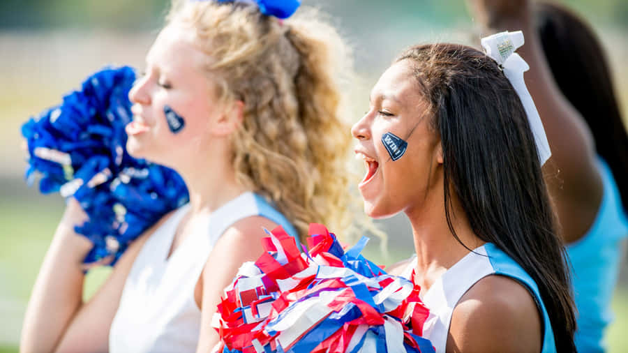 Cheerleaders Enthusiastic Performance Outdoors Wallpaper