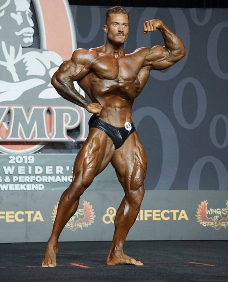 Brutal Athletic Man Muscular Body Poses Gym Showing His Biceps Stock Photo  by ©vladimirgappov@yandex.ru 219908876