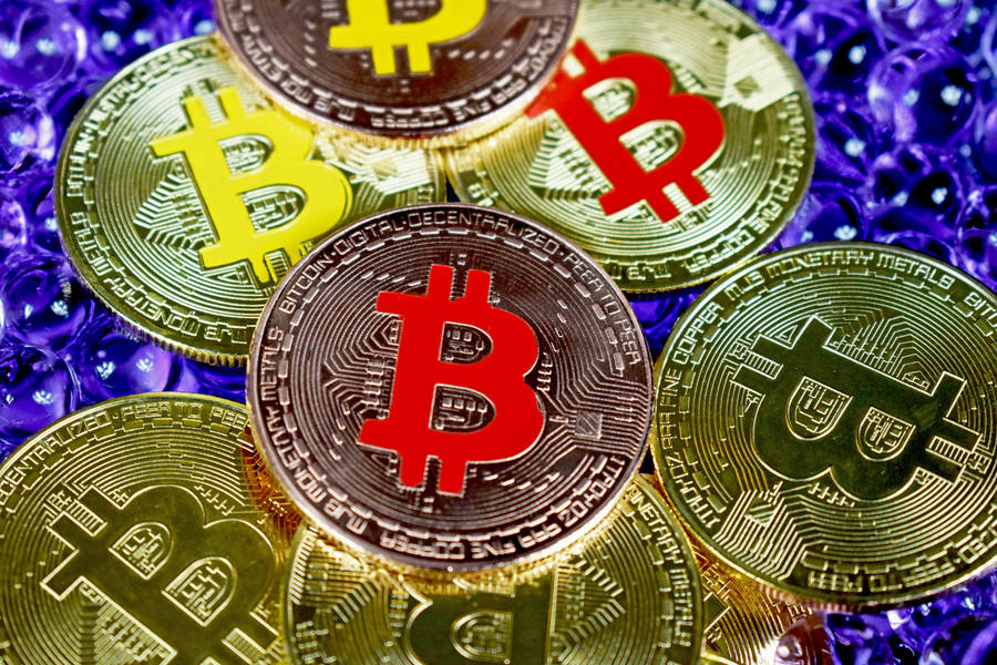 Colorful Embossed Bitcoin Tokens Wallpaper