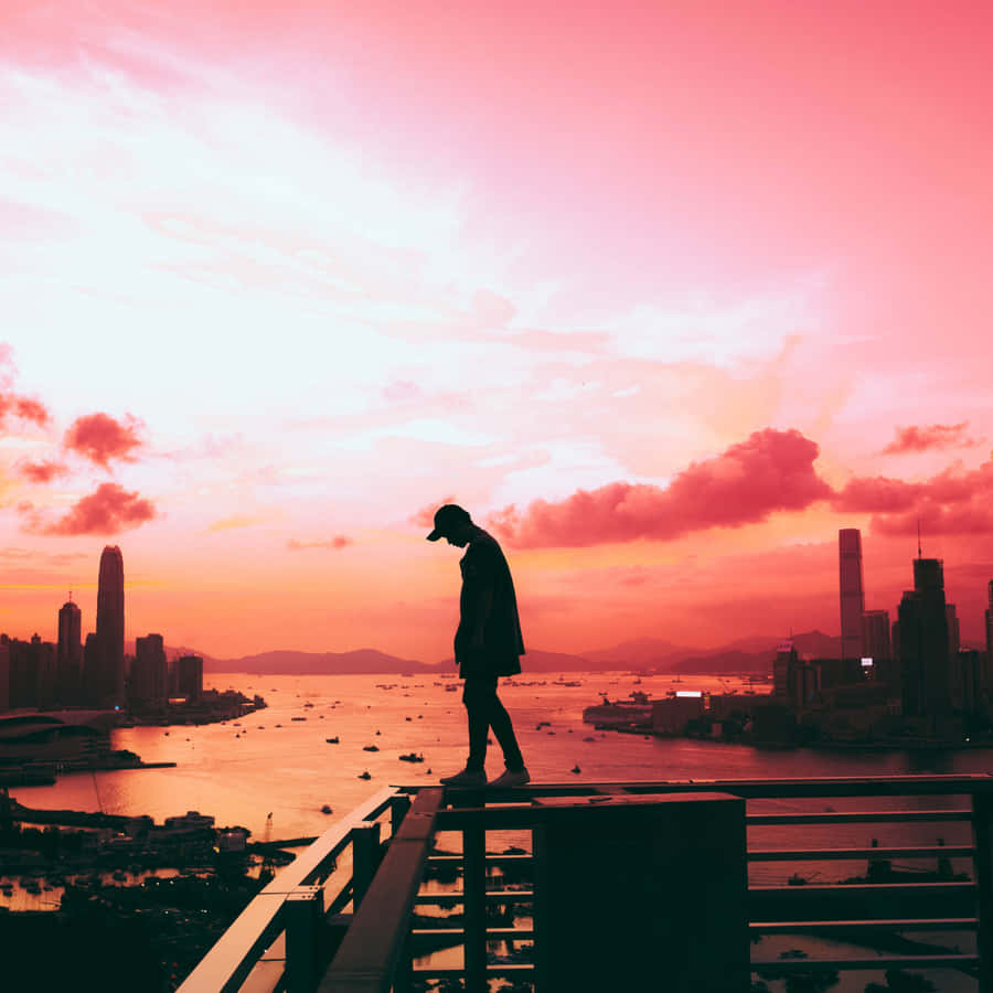 Cool Sad Boy Walking On Railings Wallpaper