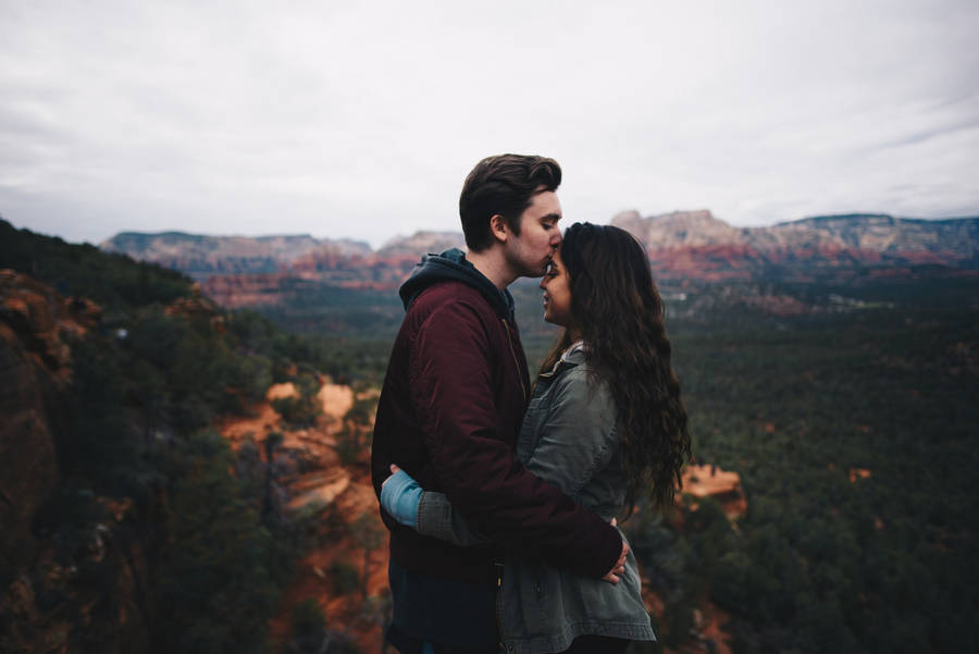 Couple Hugging With A Kiss On The Forehead Wallpaper