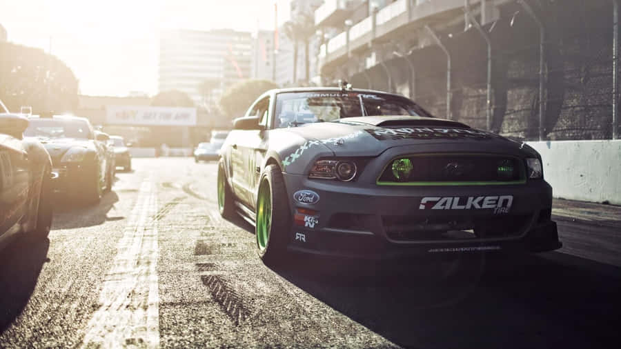 Cruise Through The City Streets In A Luxury Sports Car Wallpaper